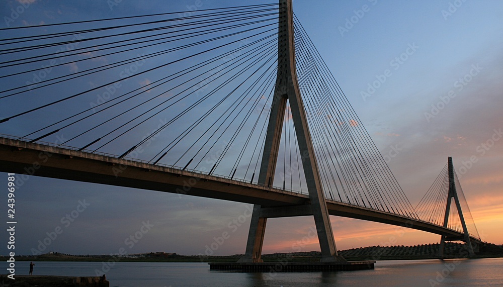 Obraz premium Atardecer sobre el puente, Ayamonte, España