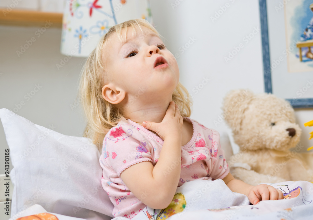 little girl in bed touching throat little girl in bed touching throat