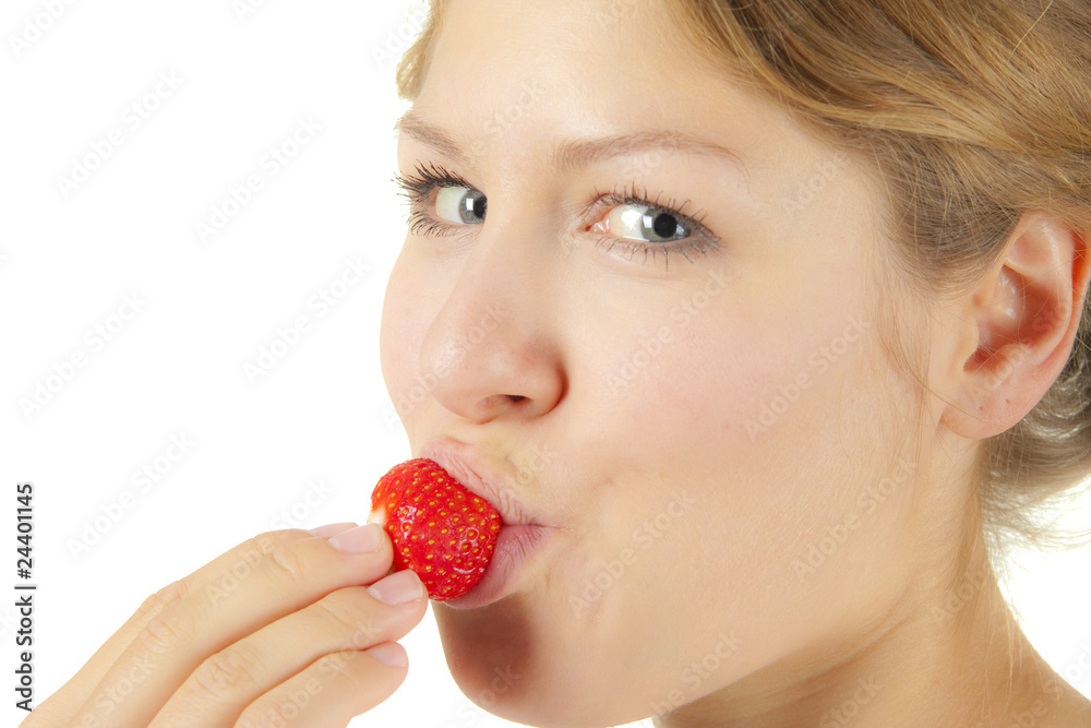 Woman eating strawberry