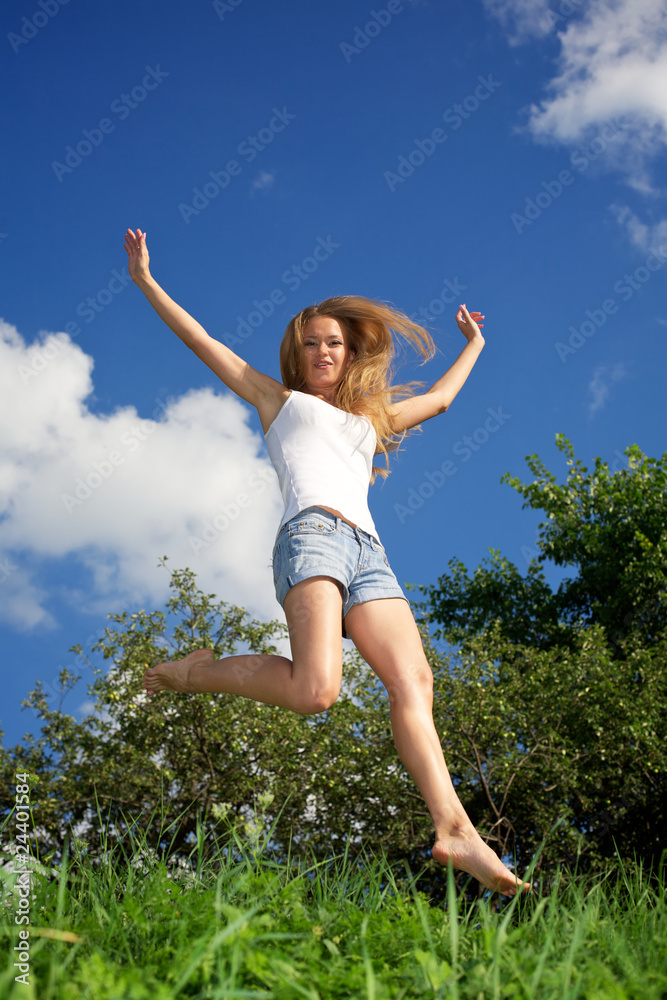 Pretty young woman jumping
