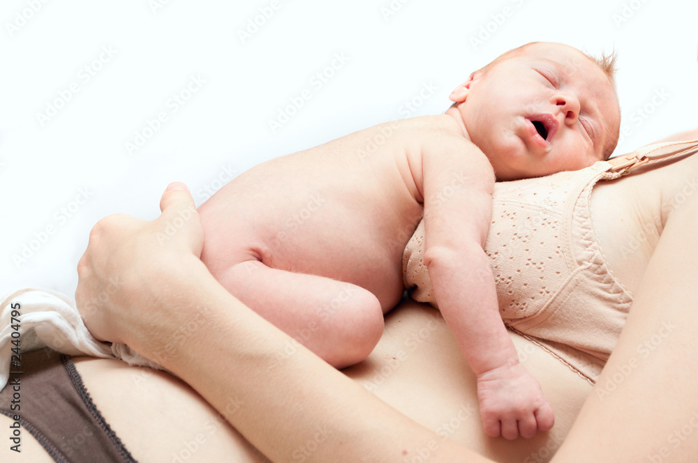 Newborn sleeping child isolated over white Newborn sleeping child isolated over white