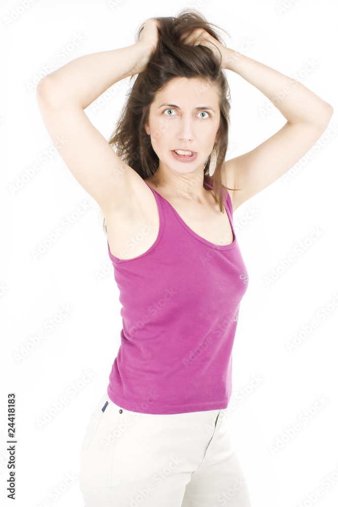 A frustrated and angry woman. Pulling her hair. A frustrated and angry woman. Pulling her hair.