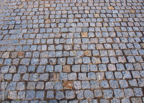 Wet old pavement tiles