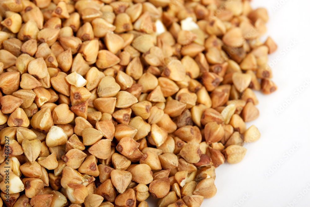 Buckwheat seeds closeup isolated on white Buckwheat seeds closeup isolated on white
