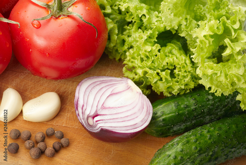 Fresh vegetables on wooden hardboard