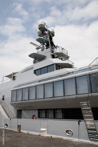 Middle part of a big yacht with a cloudy sky © ShkYo30