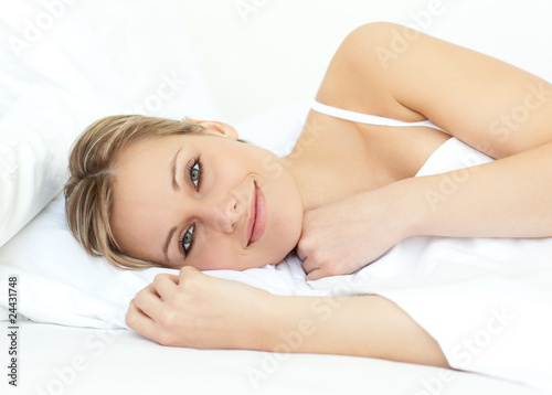 Relaxed woman lying in bed