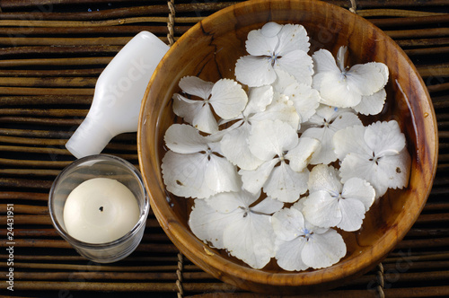 Spa setting with bowl of hydrangea and candle ,oil photo