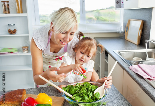 Принти на полотні Attractive mother and child cooking