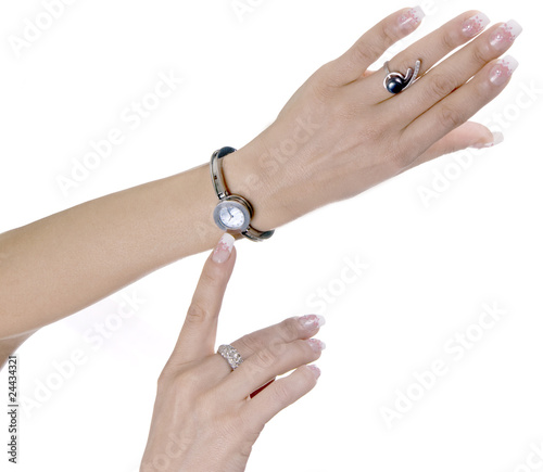 female hand specifies in hours photo