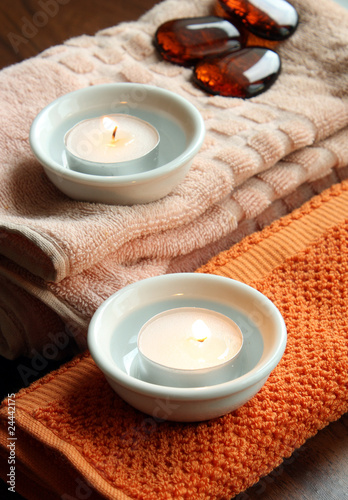 Spa candles on towels