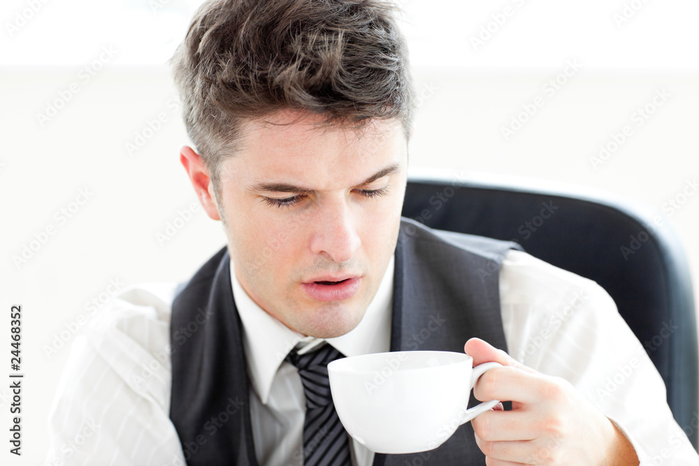 Tired businessman drinking coffee Tired businessman drinking coffee