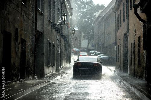 A car under a rain in the city
