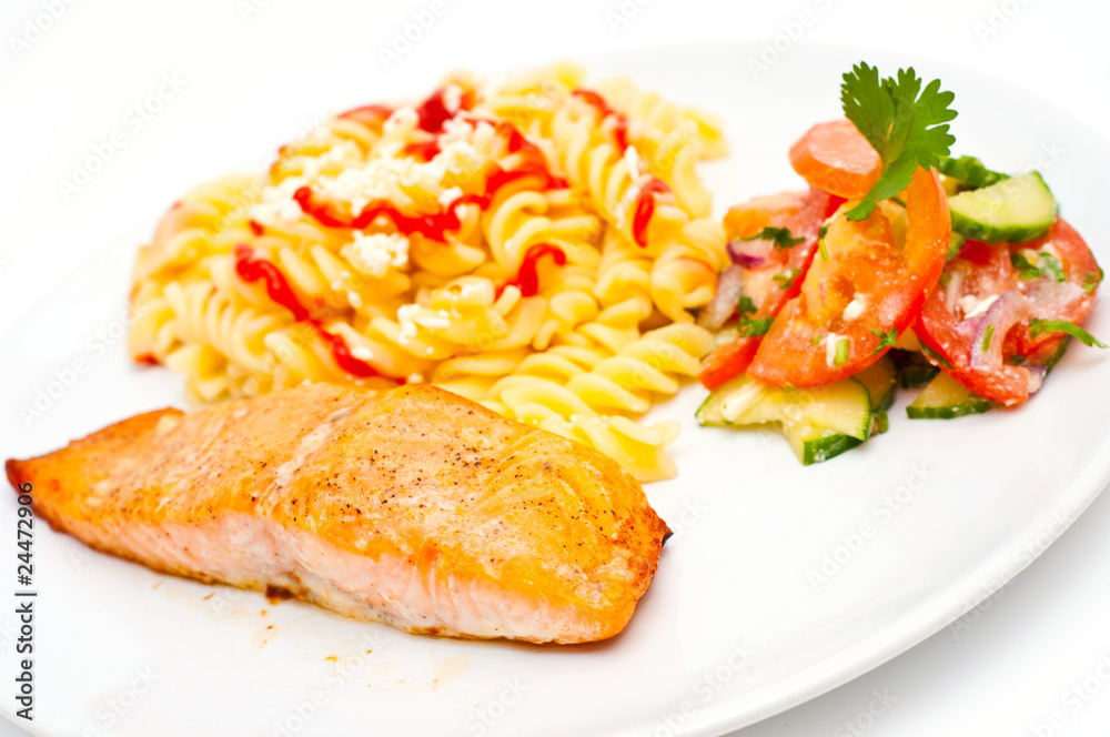 salmon served with pasta and salad