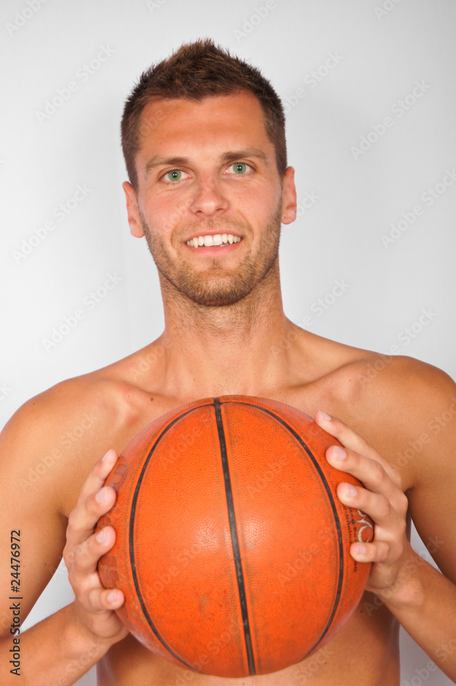 Young smiling man with basketball ball Young smiling man with basketball ball