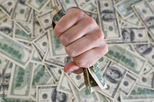fist with dollar bills