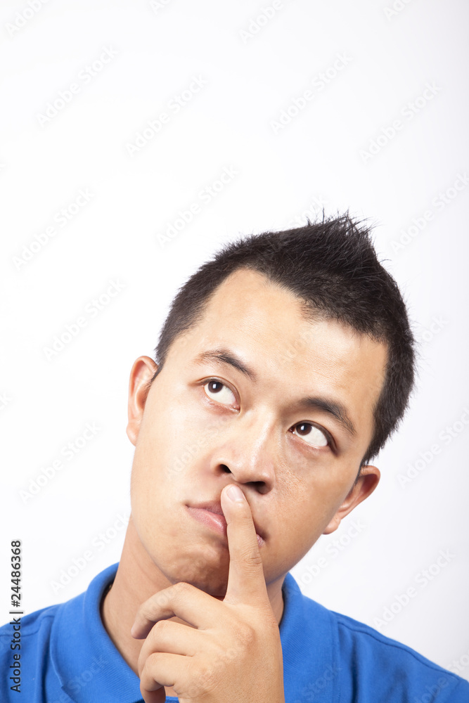 Young man thinking - portrait isolated on white .