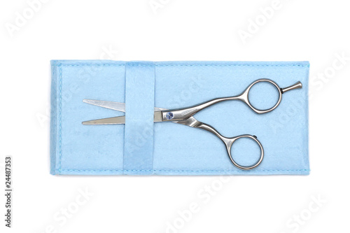 modern professional scissors in blue box isolated on white