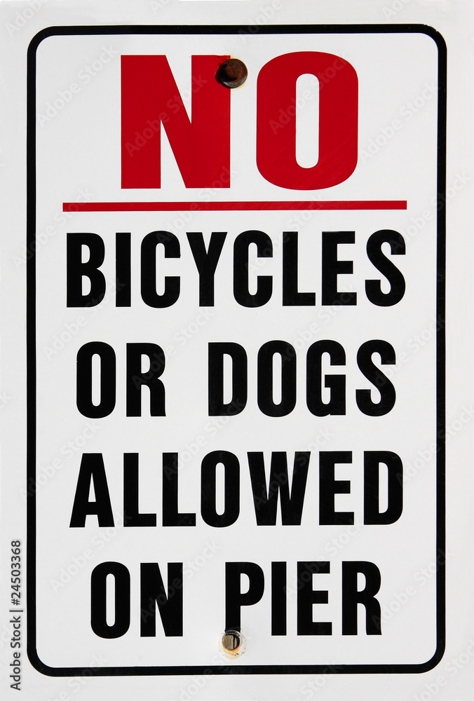 Warning sign prohibiting bicycles or dogs on pier
