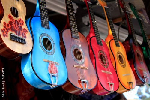 Fototapeta bright colorful guitars for sale