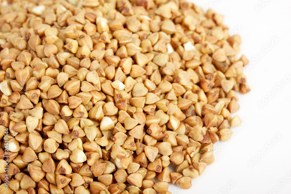 Buckwheat seeds closeup isolated on white Buckwheat seeds closeup isolated on white