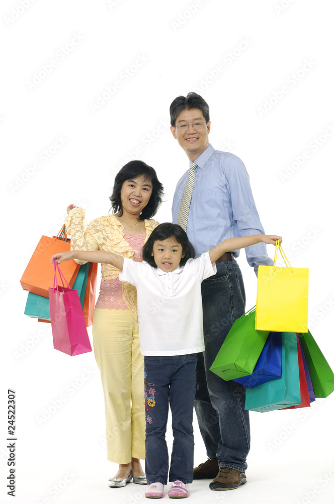 Happy family shopping. Isolated over white Happy family shopping. Isolated over white