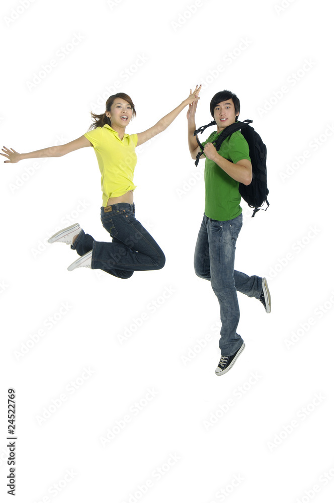 couple jumping - over a white background couple jumping - over a white background