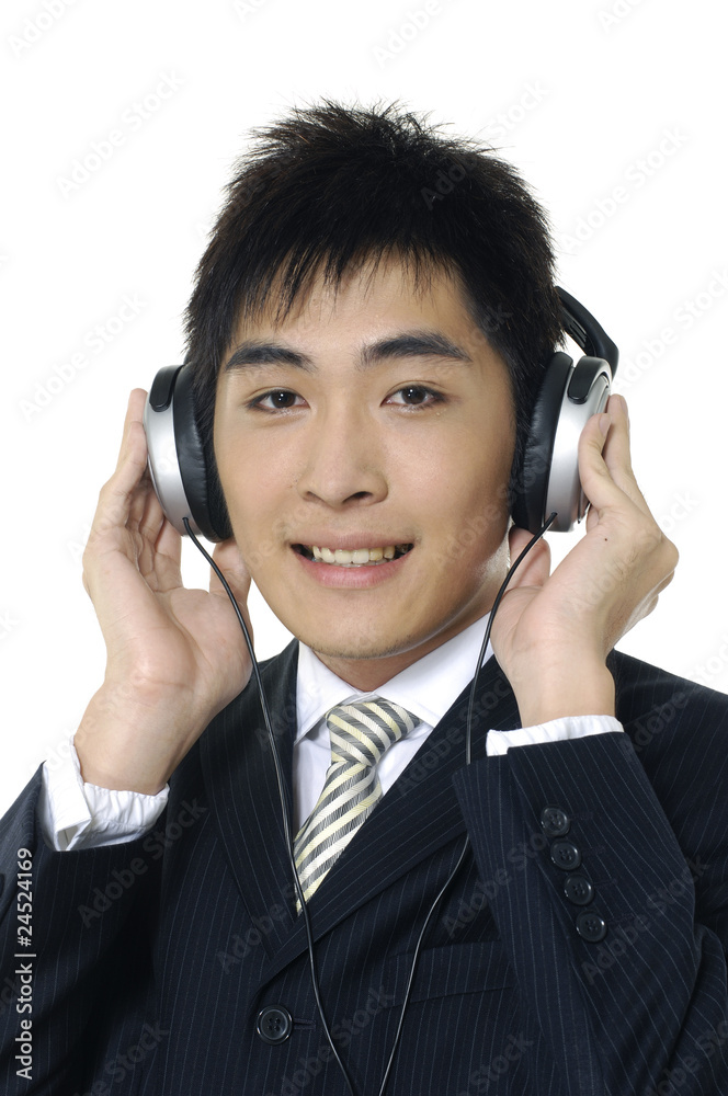 Asian young man wearing head phones Asian young man wearing head phones