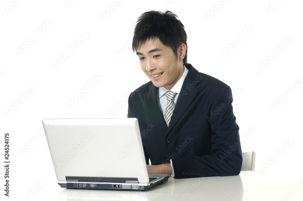 businessman working with his laptop at his desk businessman working with his laptop at his desk