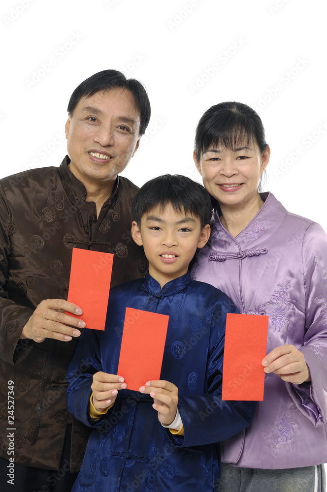 family with wearing traditional dress holding a red packet family with wearing traditional dress holding a red packet
