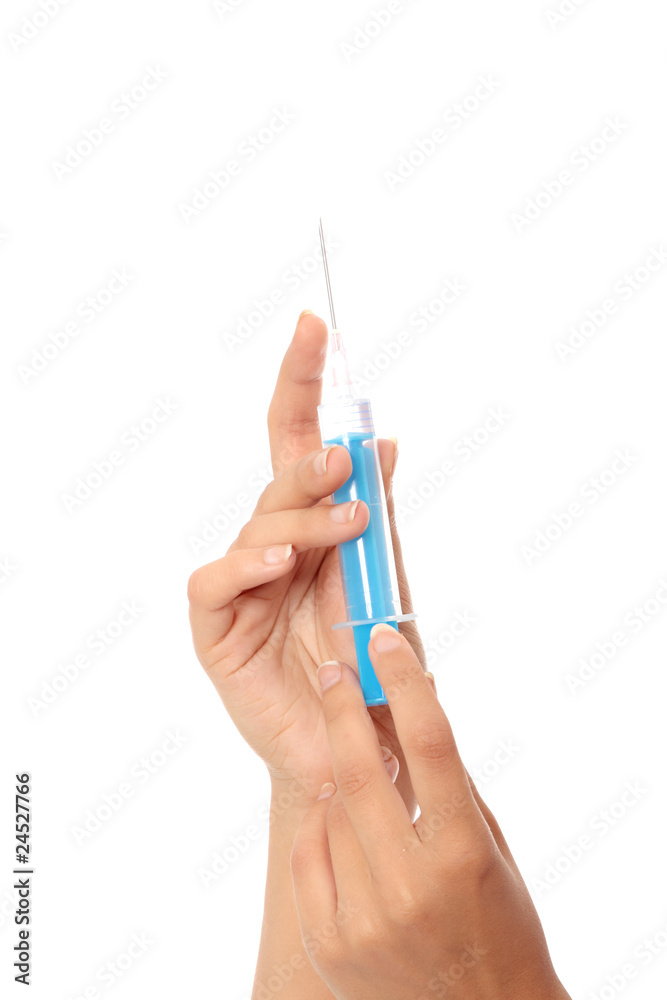 Syringe in a hand