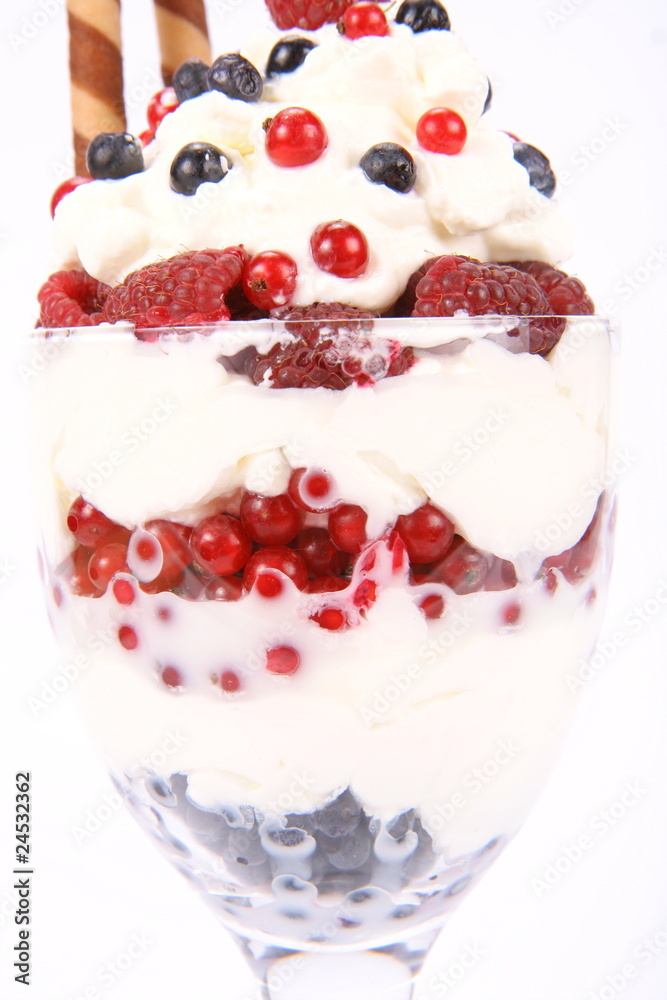 Whipped cream with fruits and a wafer tube Whipped cream with fruits and a wafer tube