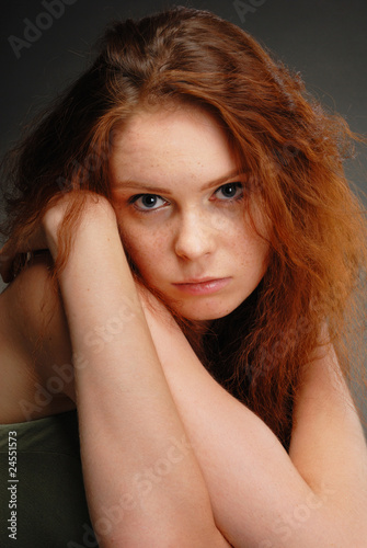 redhead girl poses in the studio