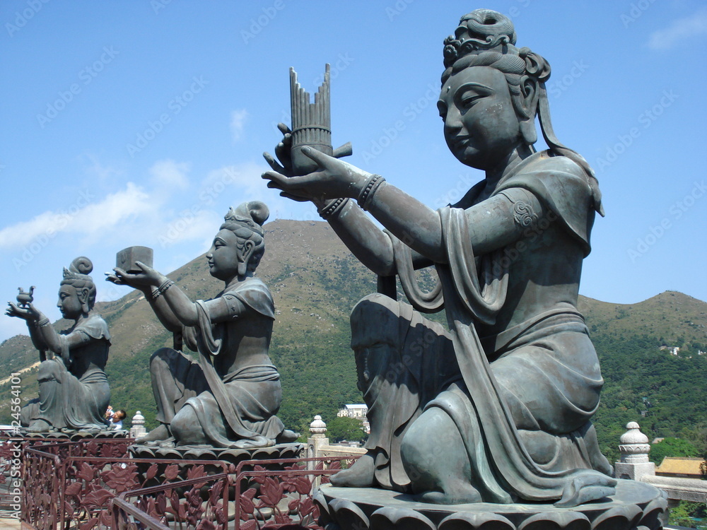 Obraz premium Buddhist statues making offerings, Lantau Island