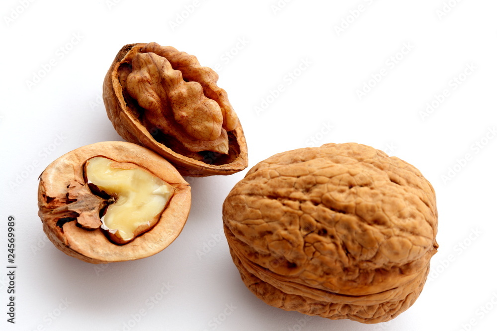Group of few ripe walnuts on white background Group of few ripe walnuts on white background