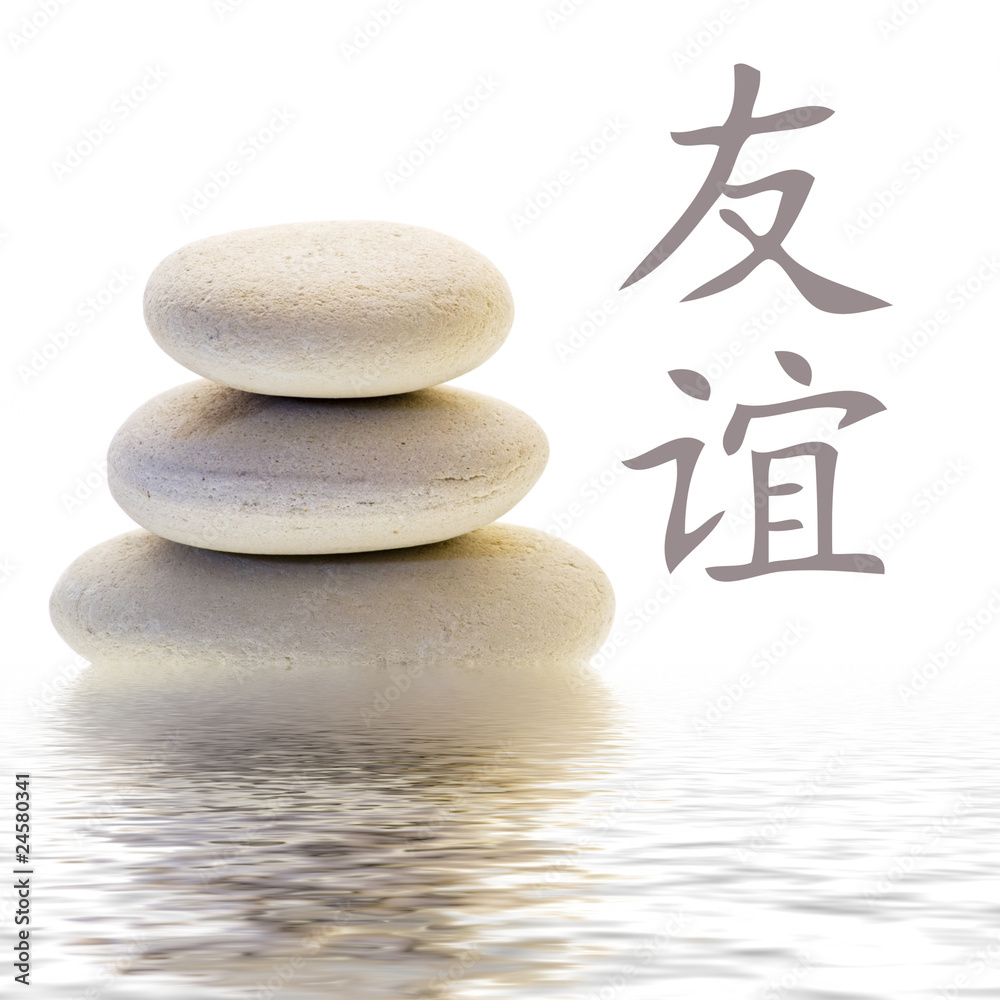 Steinturm und chinesisches Zeichen für Freundschaft StockFoto Adobe Stock
