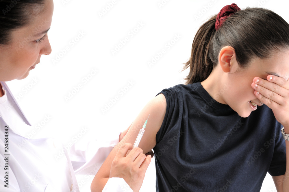 Doctor giving an injection to a teenager - MEDICAL IMAGES. Doctor giving an injection to a teenager - MEDICAL IMAGES.