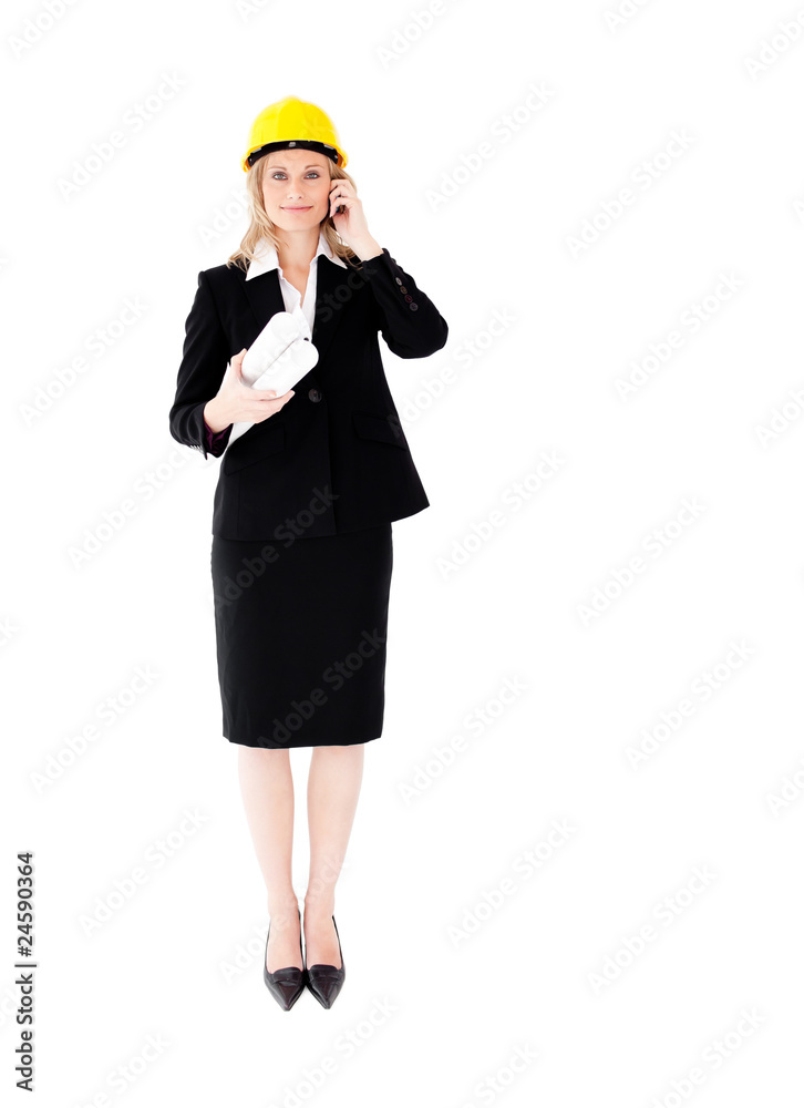 Assertive female architecture talking on phone wearing a hat Assertive female architecture talking on phone wearing a hat