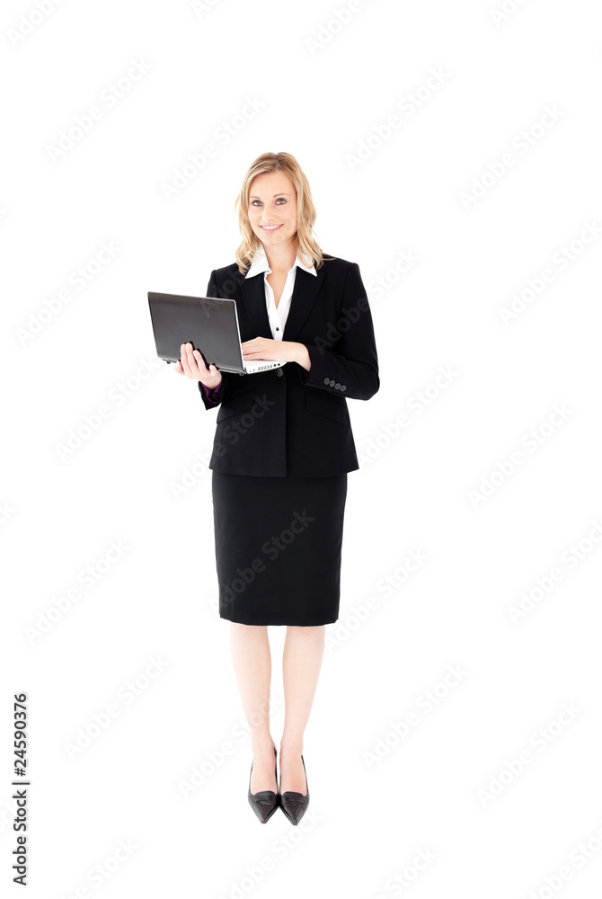 Self-assured woman using her laptop standing Self-assured woman using her laptop standing