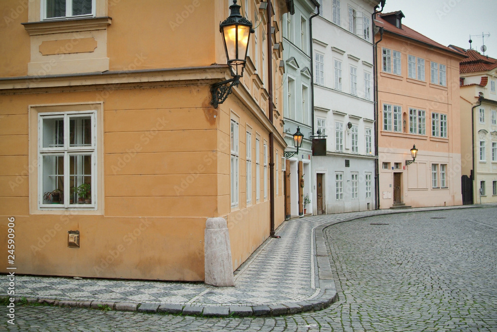 Naklejka premium Narrow alley between tenement houses in Prague