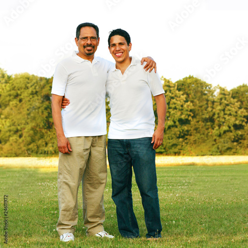Father and son full body portrait at the park