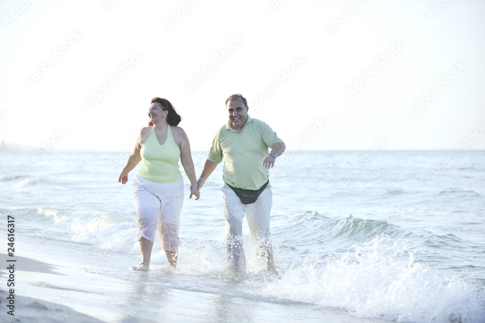 happy seniors couple on beach happy seniors couple on beach
