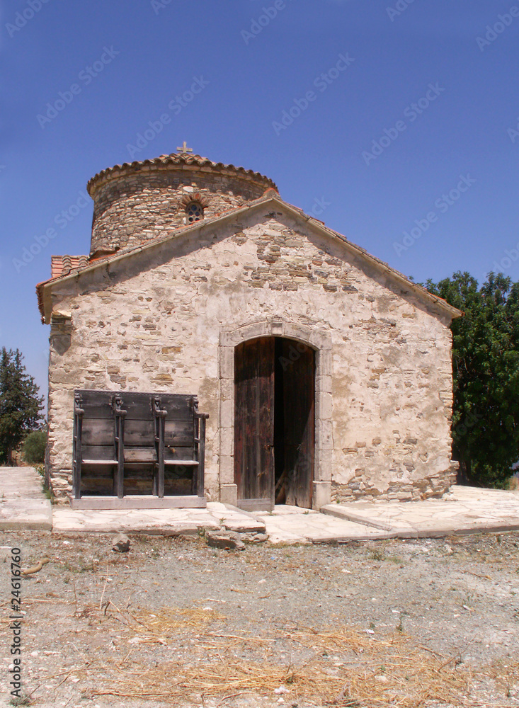 Fototapeta premium Old small stone church on a hill overlooking protaras on the isl