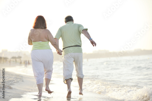 happy seniors couple  on beach © .shock