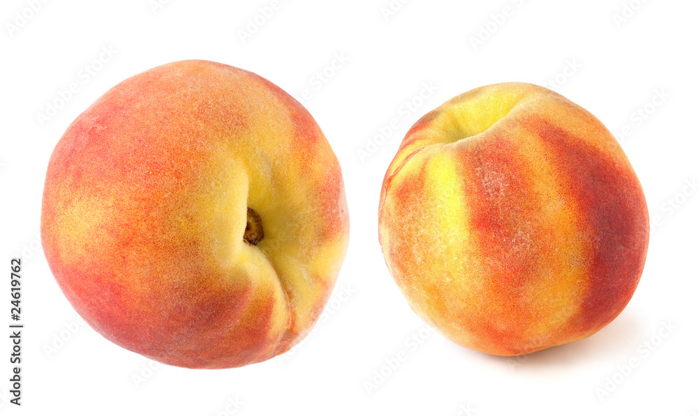 Two full peaches isolated on white background