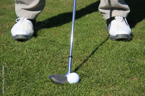Golfer with pitching wedge
