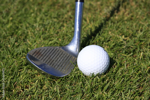 GOLF - closeup pitching wedge & golf ball
