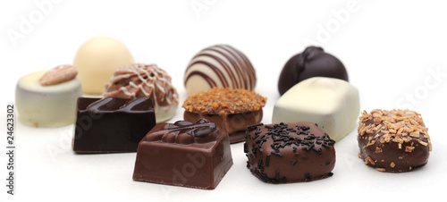 Belgian chocolates on white, shallow depth of field