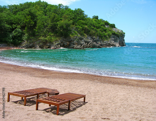 Empty beach with two chairs
