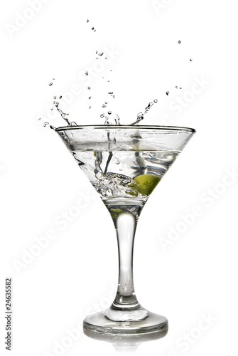 martini with olive and splash isolated on white